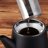 Edelstahl-Teekanne mit Stövchen. Doppelwandig, 1,2 l. Hält den Tee lange heiß, mit Tee-Ei. Teekanne